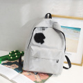 Fashion polyester customize Logo trend high school bag simple color travel backpacks pendant bags